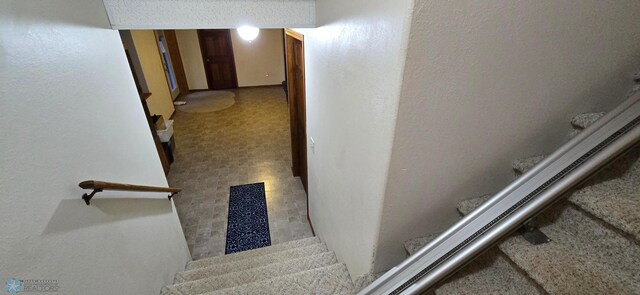 staircase with tile patterned flooring