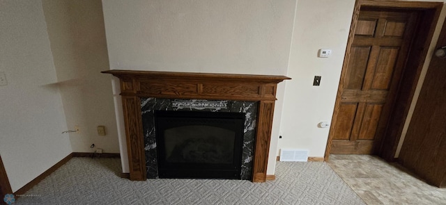 room details with a fireplace and tile patterned floors