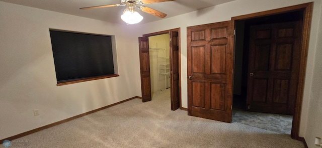 unfurnished bedroom with light carpet, a closet, and ceiling fan