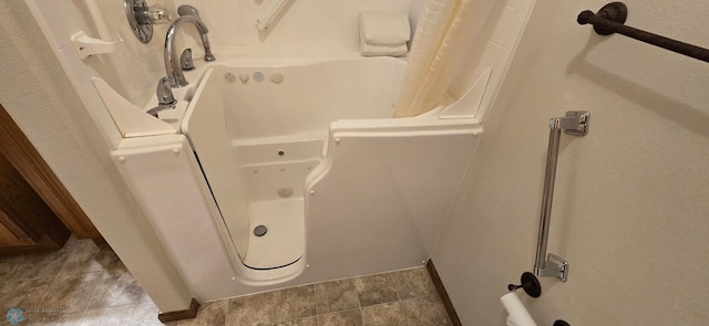 bathroom with tile patterned flooring