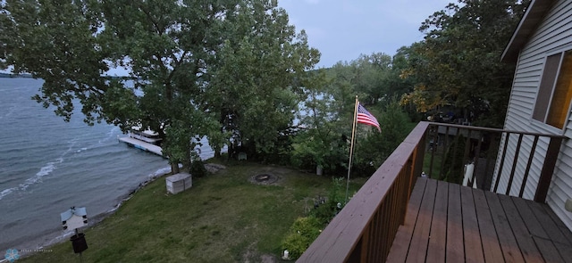 wooden terrace featuring a water view