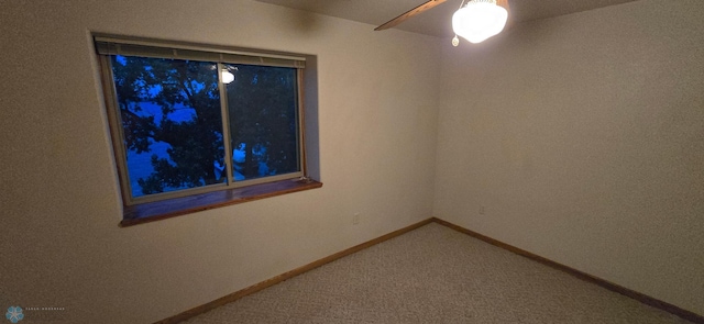 unfurnished room featuring carpet and ceiling fan