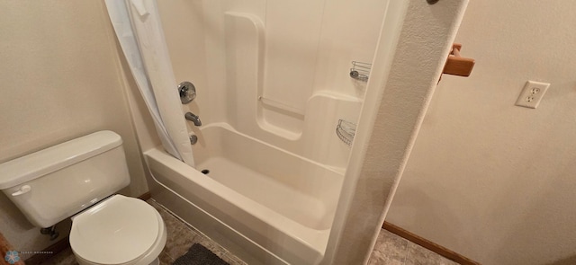 bathroom with shower / tub combination, tile patterned flooring, and toilet