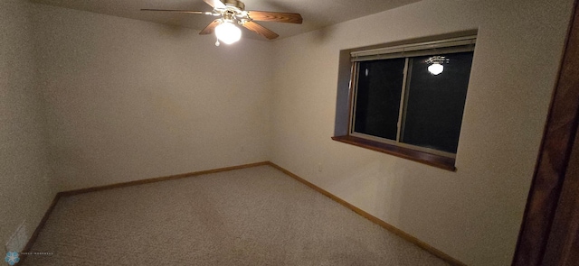 carpeted empty room with ceiling fan