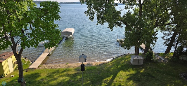 property view of water featuring a boat dock