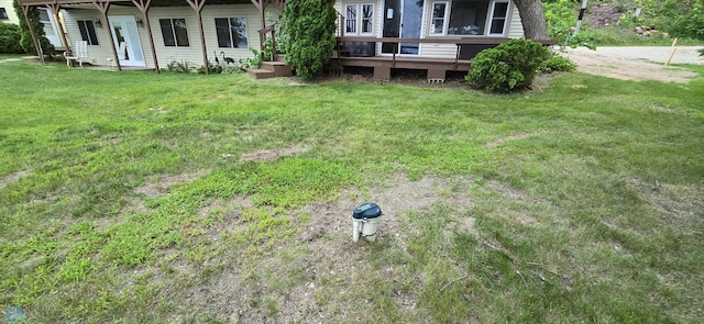 view of yard with a deck