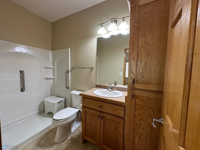 bathroom with vanity, walk in shower, tile patterned flooring, and toilet