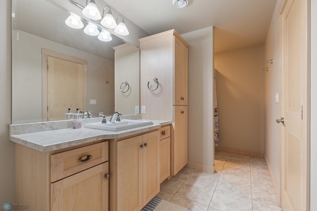 bathroom with vanity and tile patterned flooring