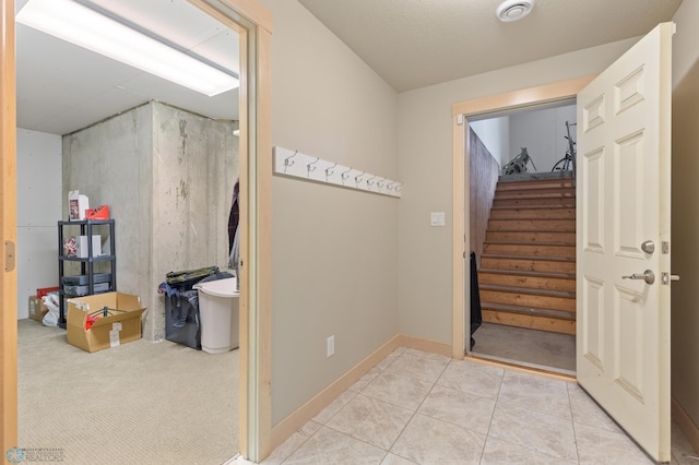 foyer entrance with light tile patterned flooring