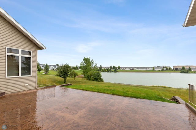 view of patio with a water view