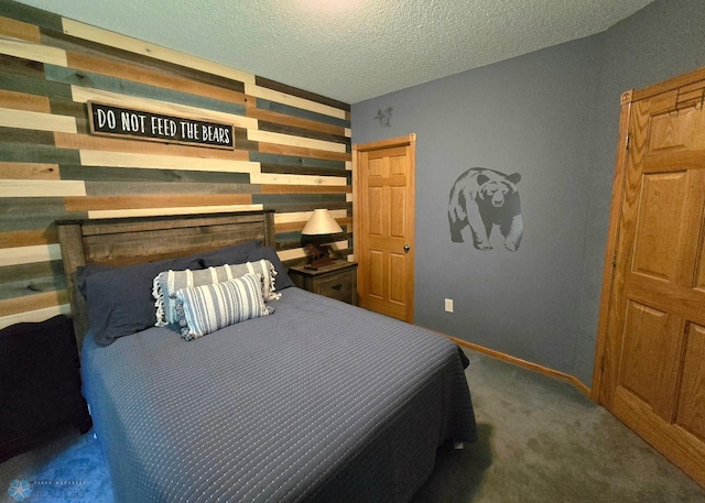 carpeted bedroom featuring a textured ceiling