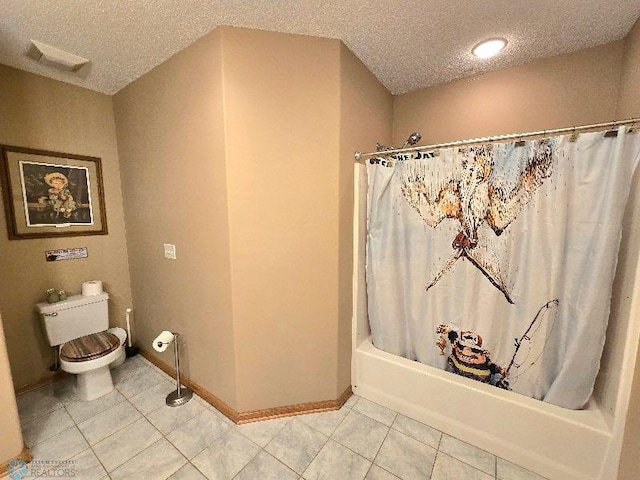 bathroom with shower / bath combo with shower curtain, tile patterned floors, toilet, and a textured ceiling