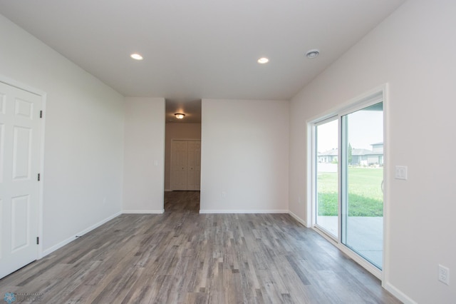 unfurnished room featuring wood-type flooring