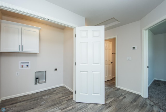 clothes washing area featuring cabinets, hookup for a washing machine, electric dryer hookup, and dark hardwood / wood-style floors