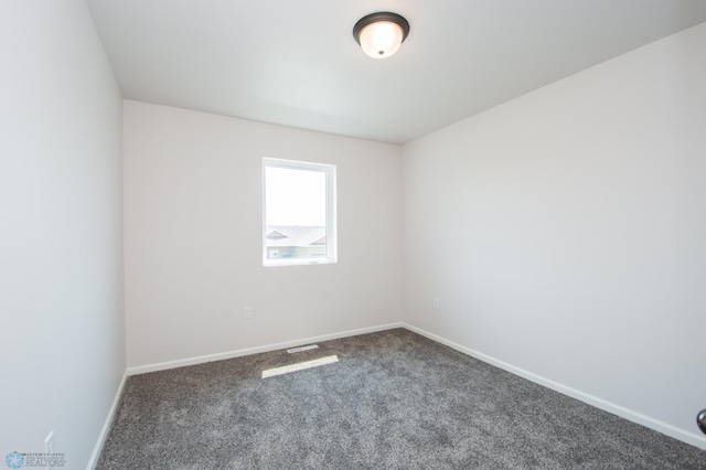 empty room featuring carpet flooring