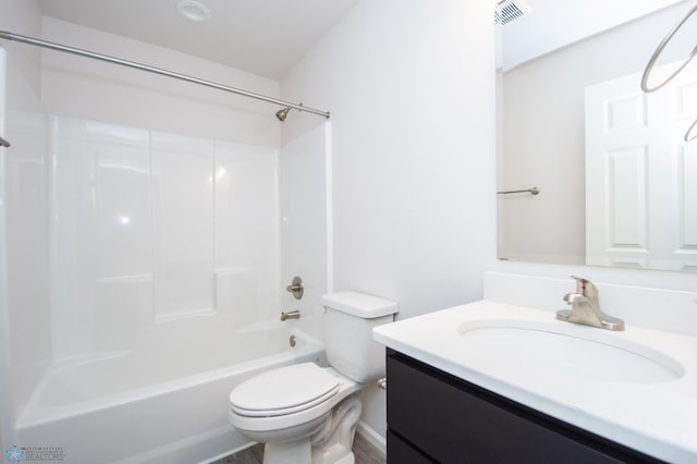 full bathroom with bathtub / shower combination, toilet, and vanity