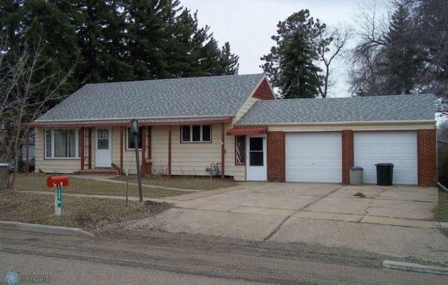 ranch-style house featuring a garage