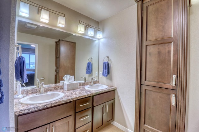 bathroom featuring dual vanity