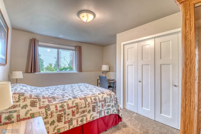 bedroom featuring a closet and carpet