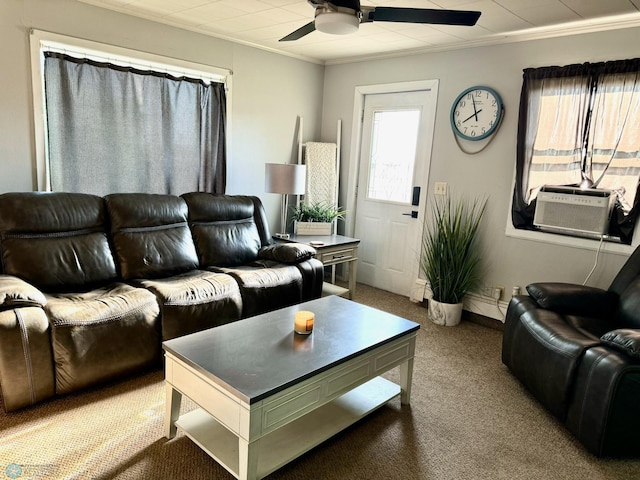 living room featuring carpet, ceiling fan, and crown molding