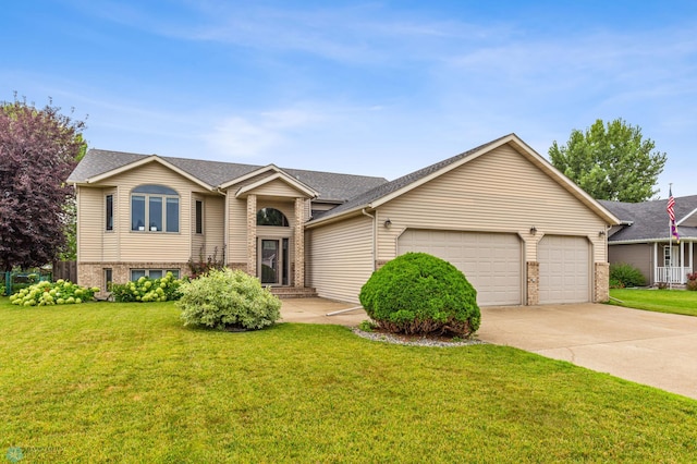 view of front of house with a front lawn and a garage