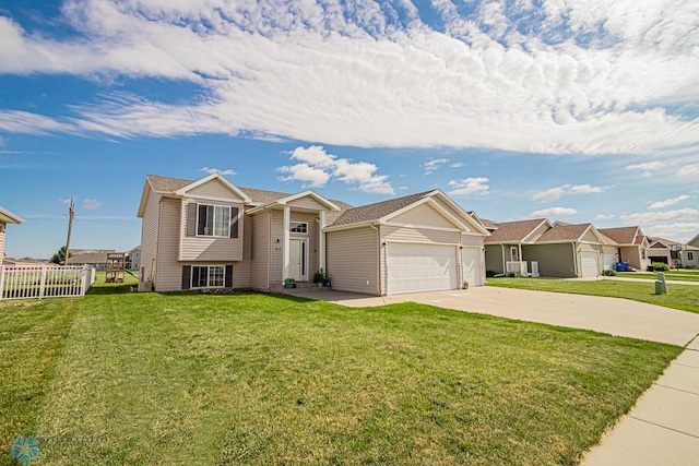 view of front facade featuring a front yard and a garage