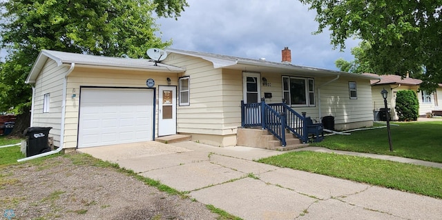 single story home with a front yard and a garage