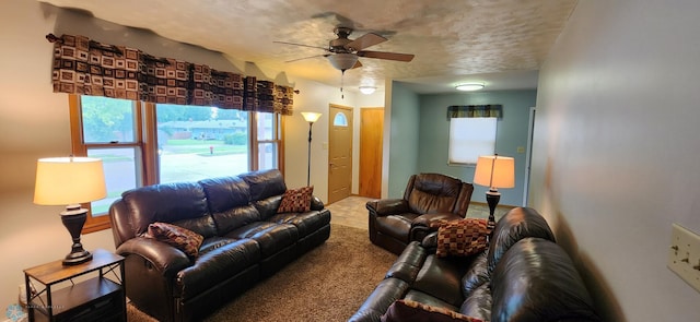 living room featuring ceiling fan and carpet floors