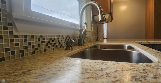 kitchen with backsplash and sink