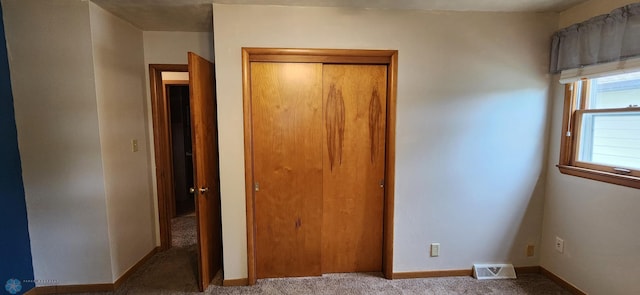 unfurnished bedroom featuring carpet flooring