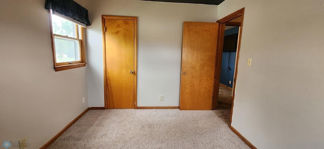 unfurnished bedroom featuring carpet floors