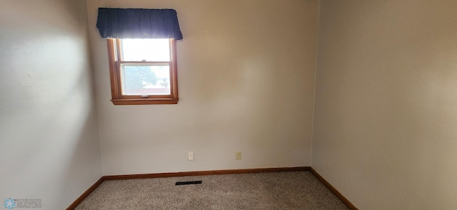 empty room featuring carpet floors