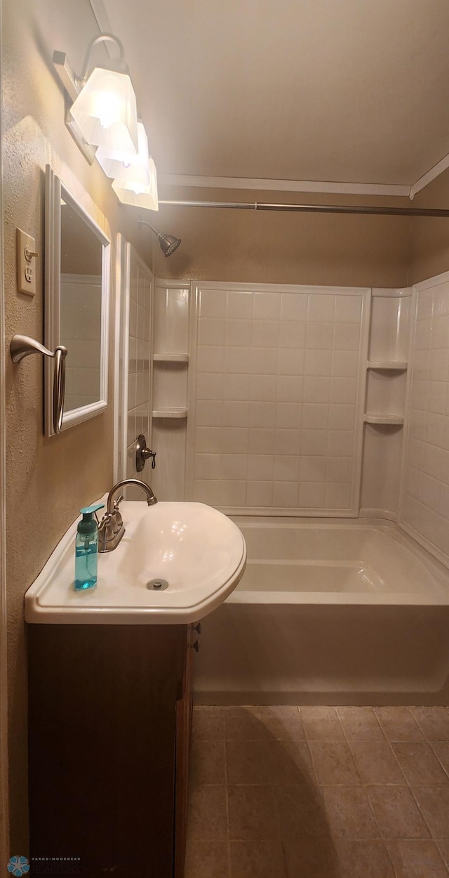 bathroom featuring bathing tub / shower combination, vanity, tile patterned floors, and crown molding