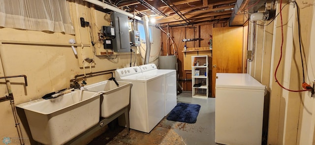 laundry room featuring sink and separate washer and dryer