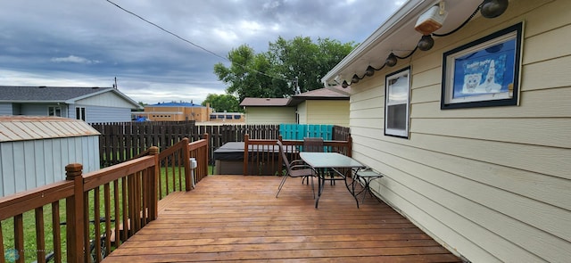 wooden terrace featuring a shed