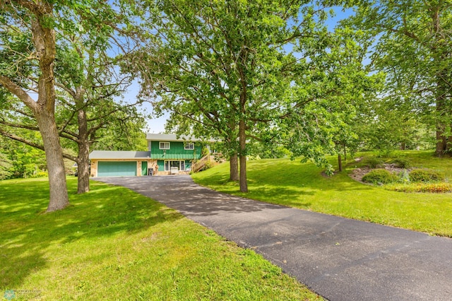 view of front facade with a front lawn and a garage