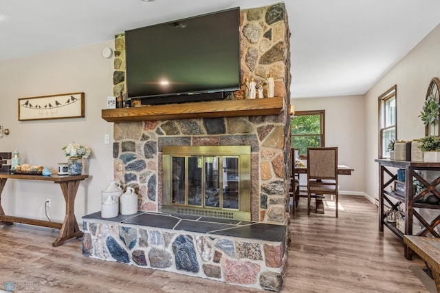 living room featuring a fireplace and hardwood / wood-style floors