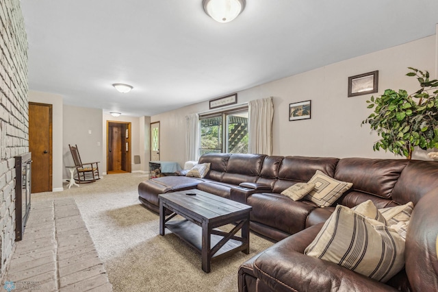 living room with a fireplace and light colored carpet