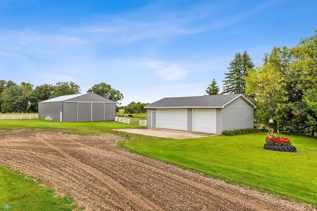 garage with a yard