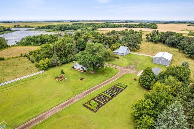 birds eye view of property featuring a rural view and a water view