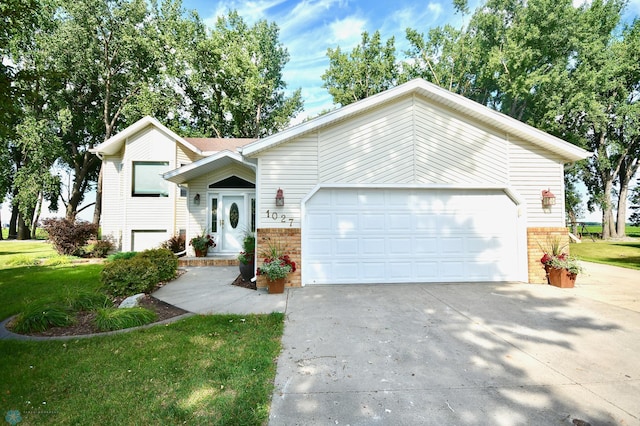 single story home with a front lawn and a garage