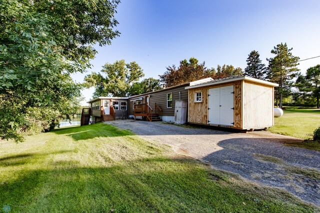 exterior space with a shed