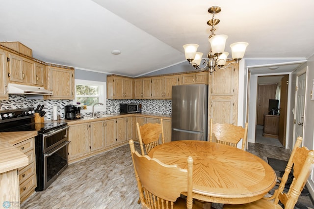 tiled dining area featuring a notable chandelier, sink, and vaulted ceiling