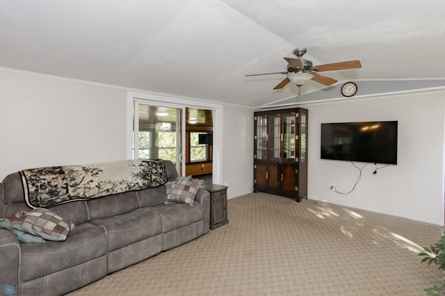 carpeted living room with ceiling fan, crown molding, and vaulted ceiling