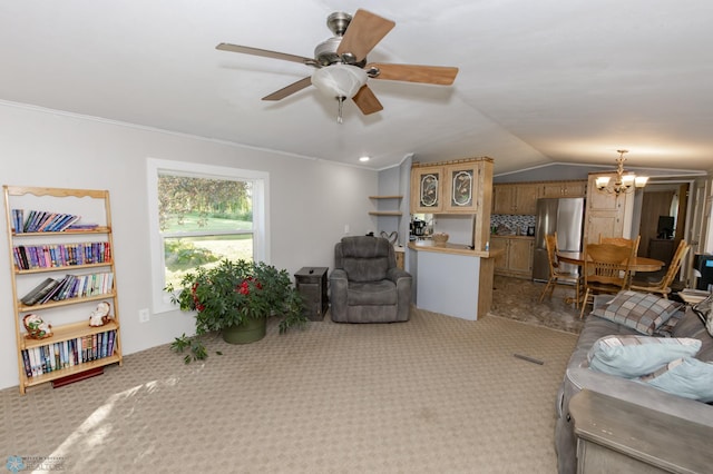 living room with ceiling fan with notable chandelier, crown molding, carpet floors, and vaulted ceiling