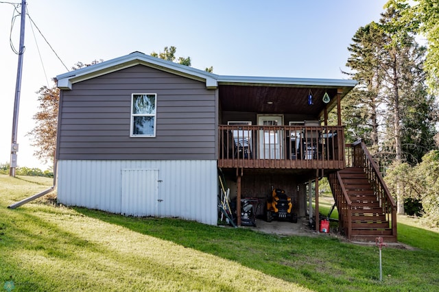 back of property featuring a lawn and a deck