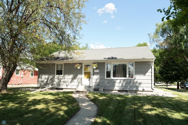 single story home with a front yard