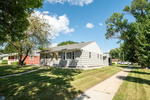 ranch-style house featuring a front lawn