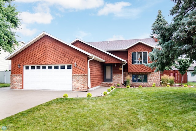 view of front of property with a garage and a front yard