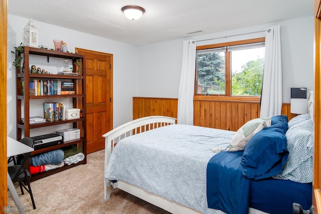 bedroom featuring light colored carpet